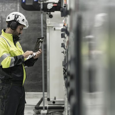 male worker checking AMCC in chiller plant room